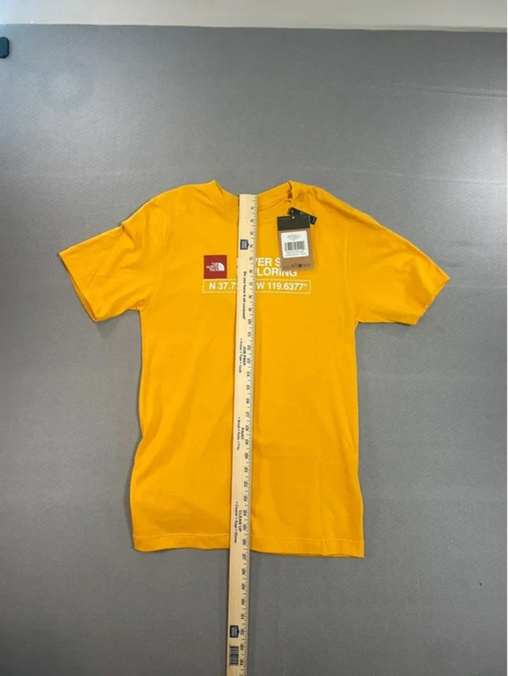 The Northface yellow “Never stop exploring” T-shirt Size XS - Picture 6 of 7